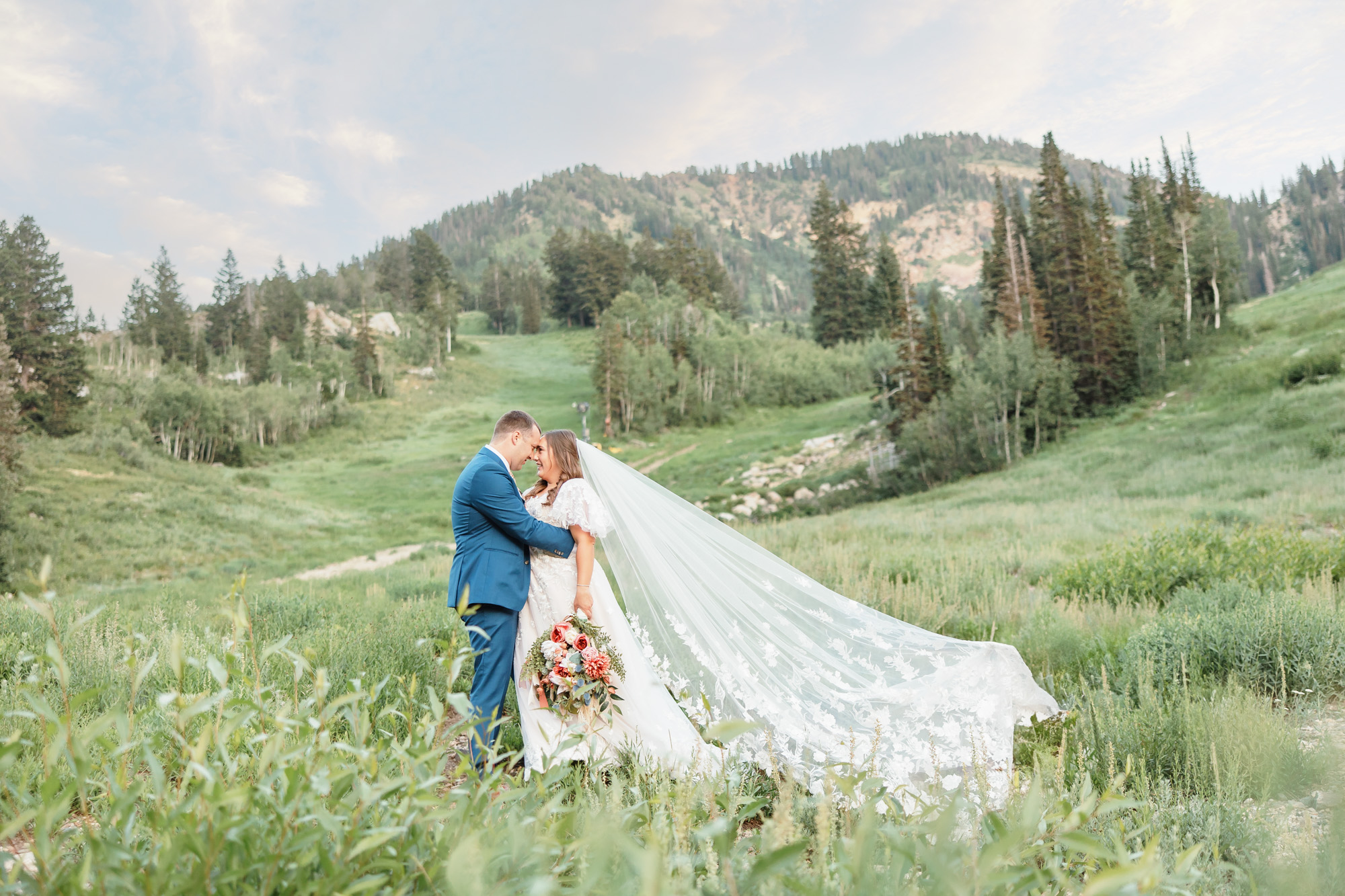 Bride and Groom in the mountains with wildflowers